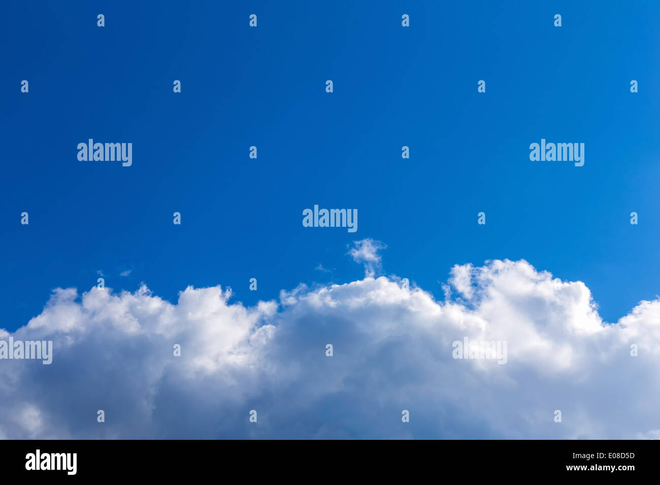 White fluffy clouds on blue hi-res stock photography and images - Alamy
