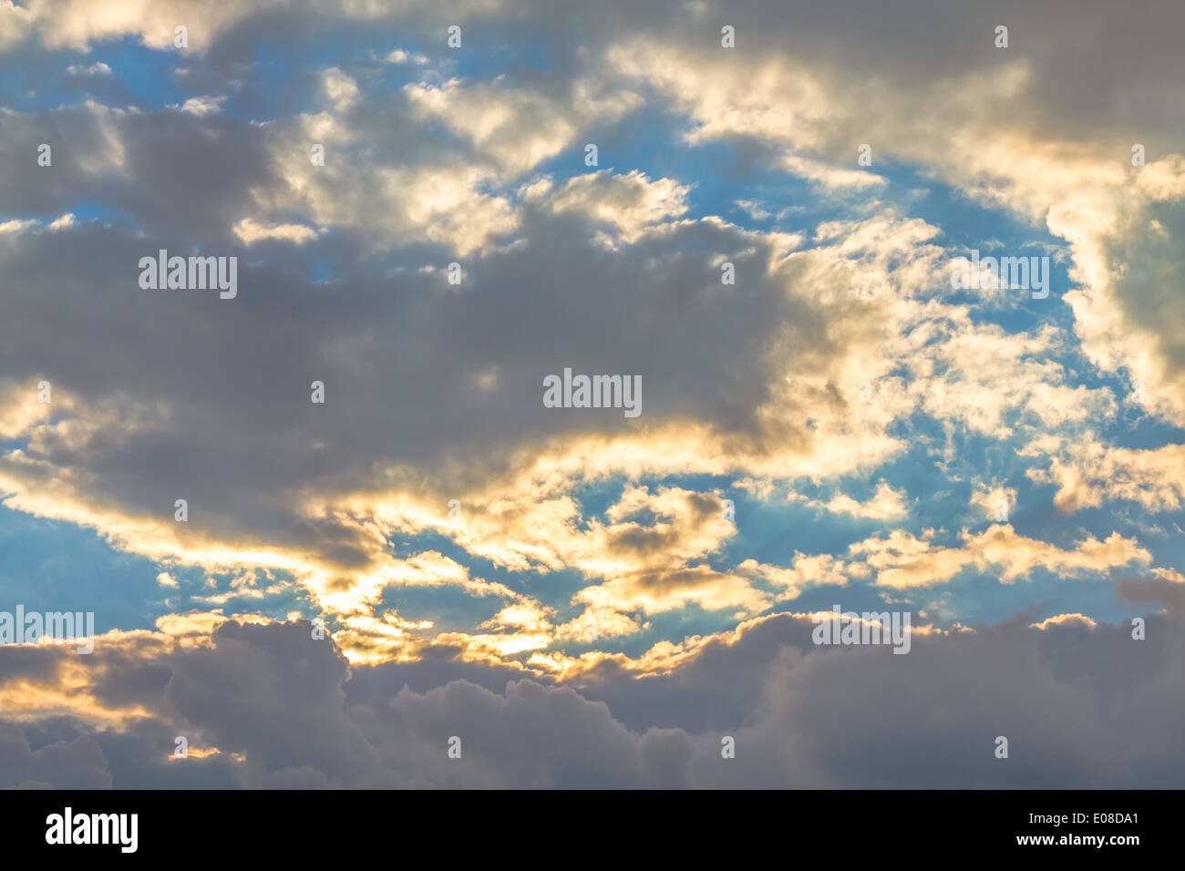 Clouds at sunset on sky background Stock Photo - Alamy