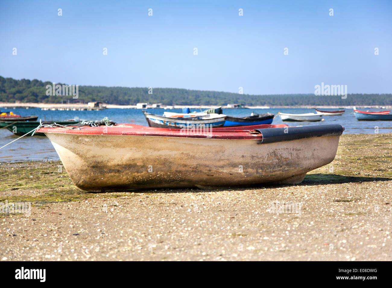 Old and abandoned row boat on the beach Stock Photo
