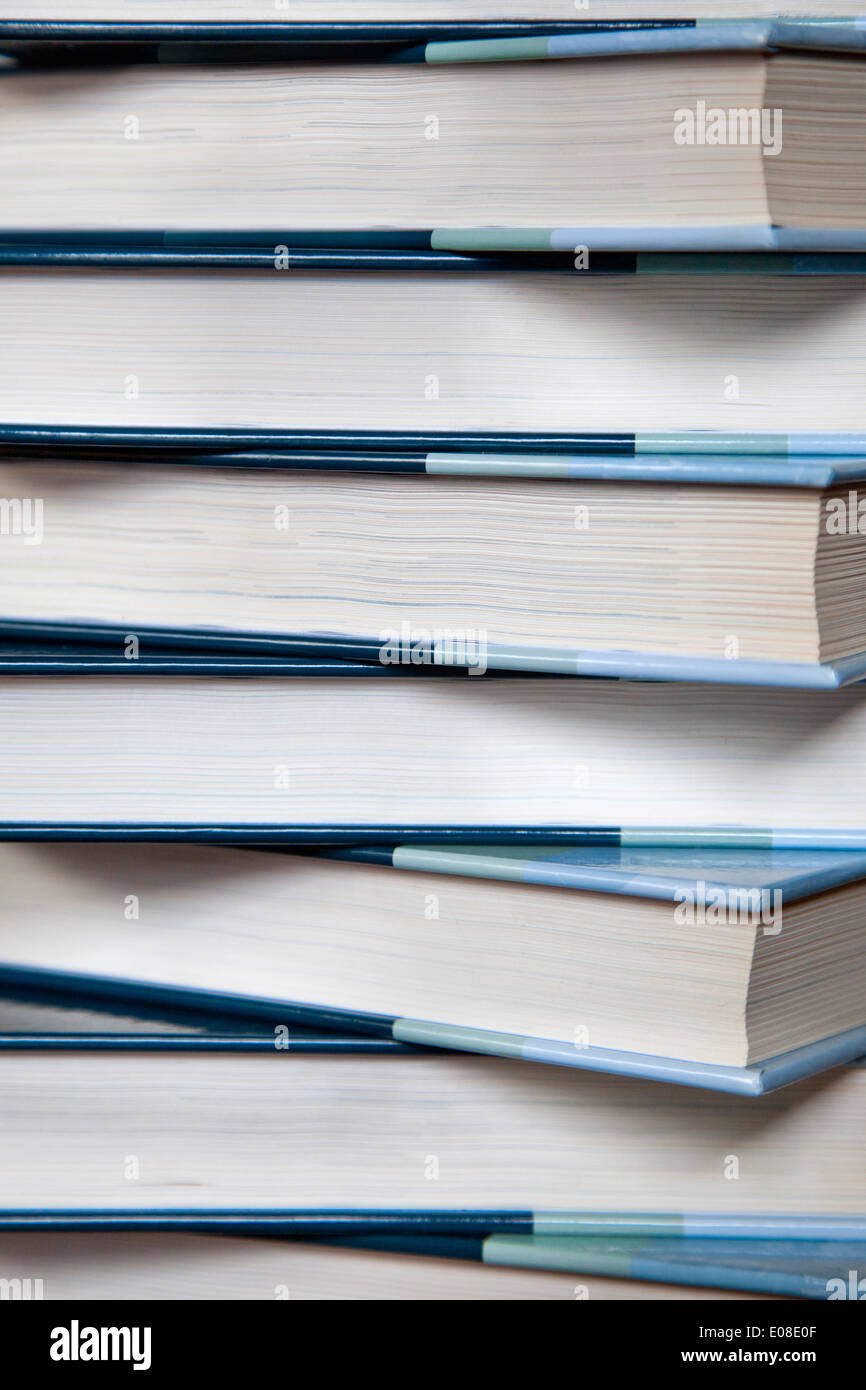 Close up view of a pile of hard cover books. Stock Photo