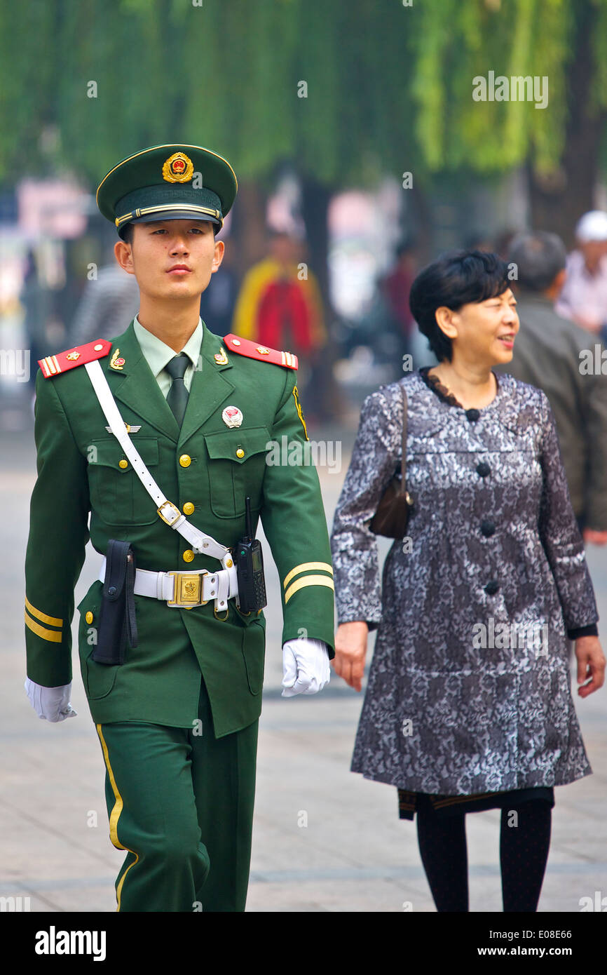Marching Alone, Young Peoples Liberation Army Soldier Patrols The Streets In By Tiananmen Square, Beijing. Stock Photo