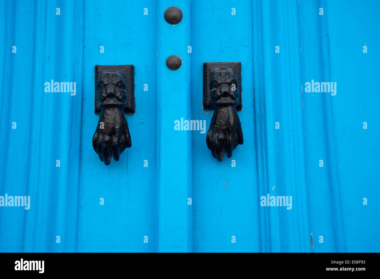 Sidi Bou Said, Tunisia 2014. Traditionally decorated bright blue door with two hands as door knockers. Stock Photo