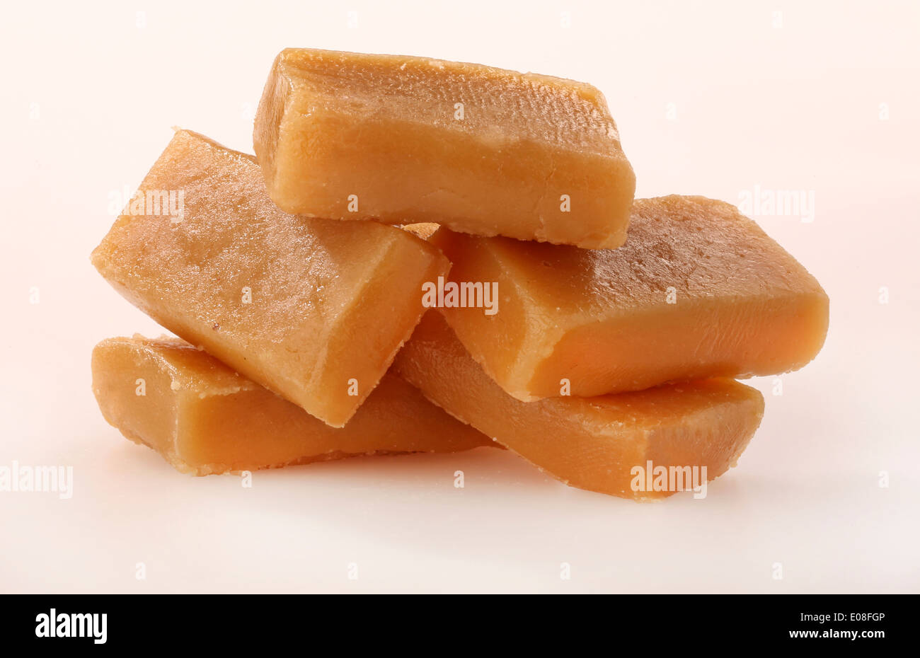 STACK OF TOFFEE PIECES Stock Photo
