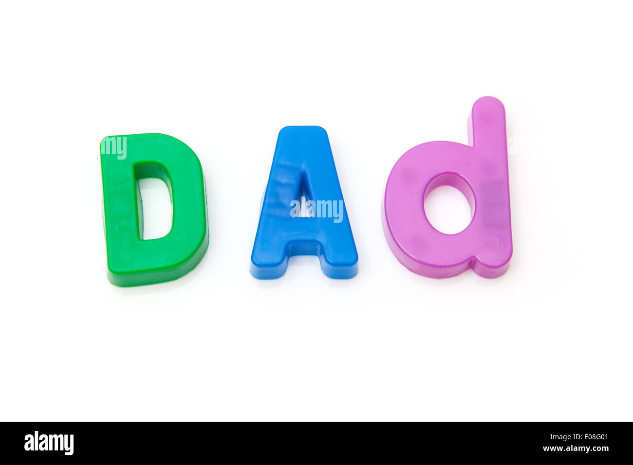 Dad written in magnetic letters isolated on a white studio background. Stock Photo