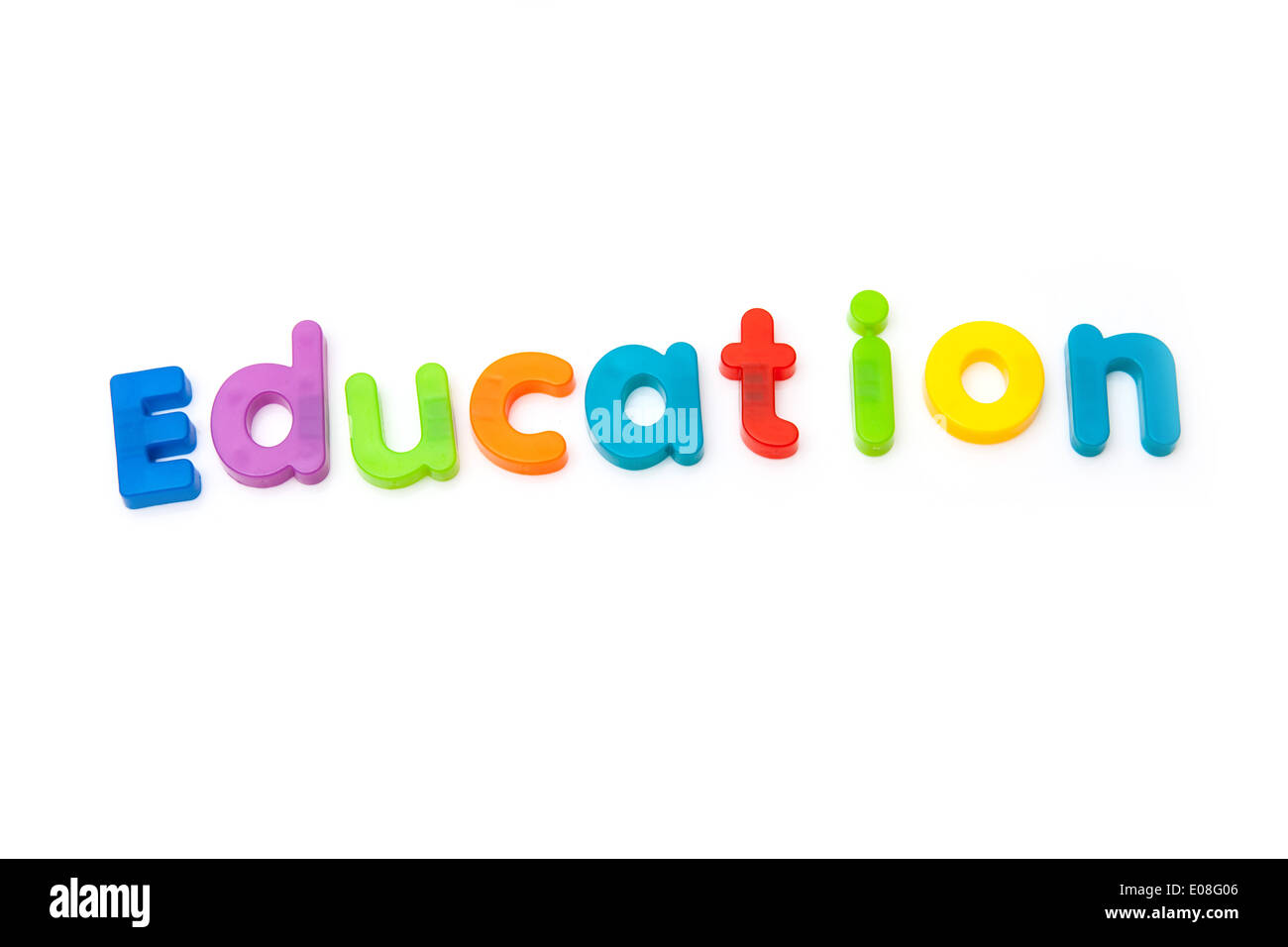 Education written in magnetic letters. on a white studio background. Stock Photo