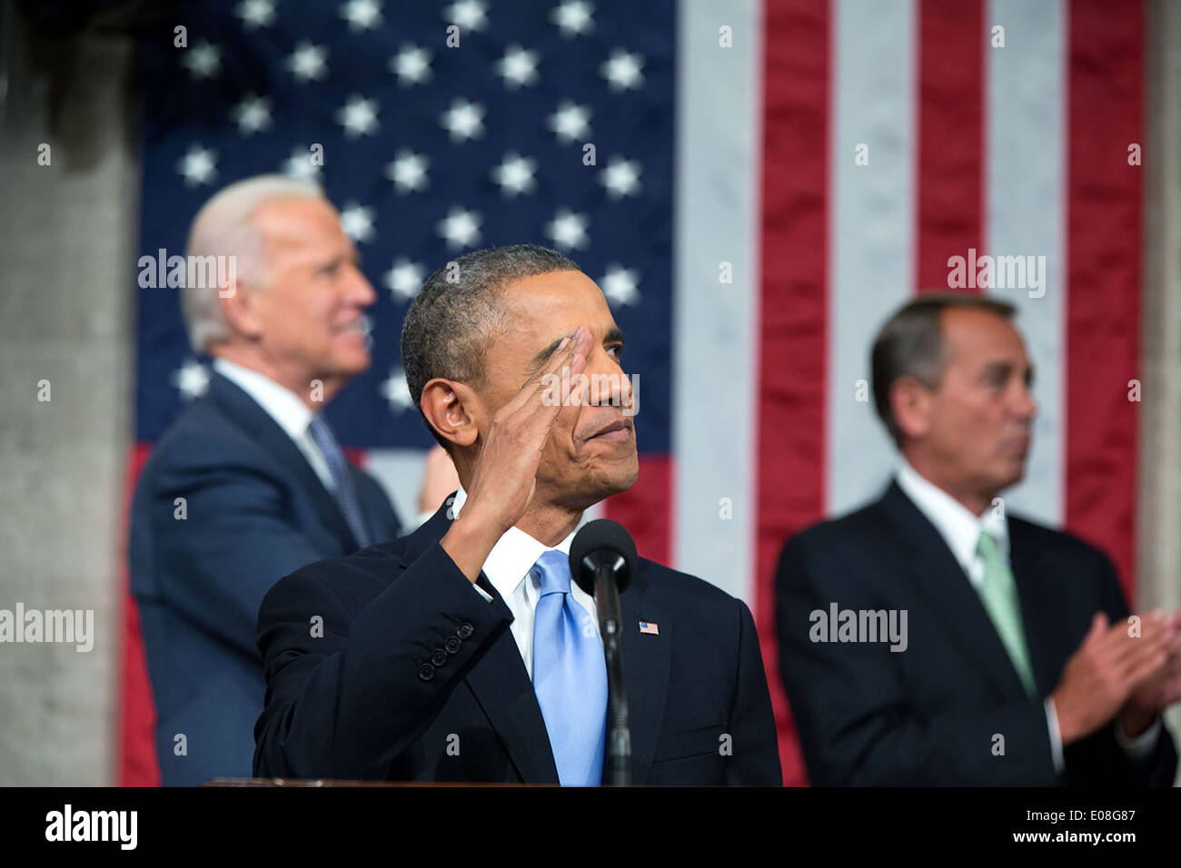 US President Barack Obama acknowledges U.S. Army Ranger Sergeant First Class Cory Remsburg during his State of the Union address in the House Chamber at the U.S. Capitol January 28, 2014 in Washington, DC. Stock Photo