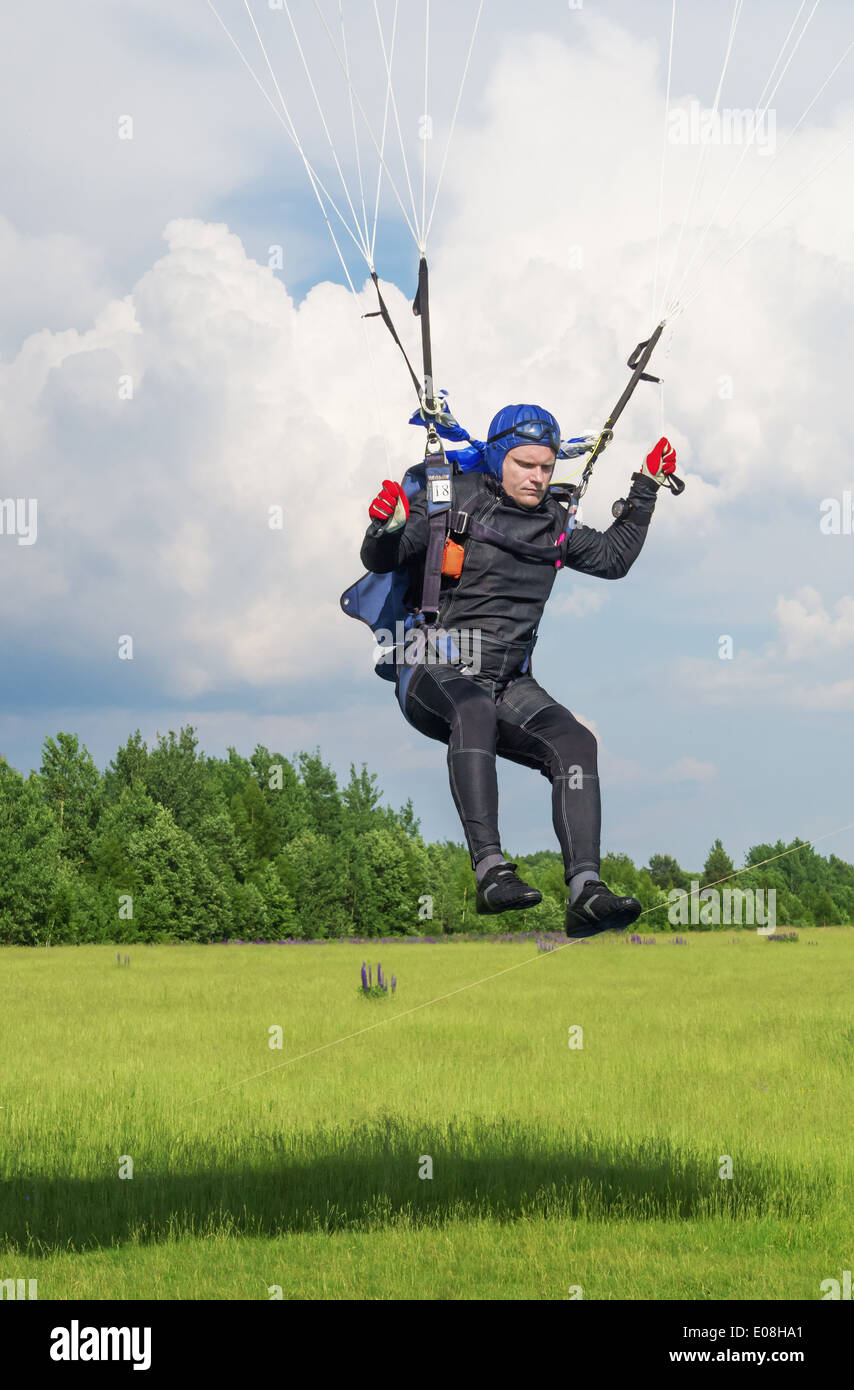 One day with parachutist in airfield. The skydiver landing Stock Photo ...