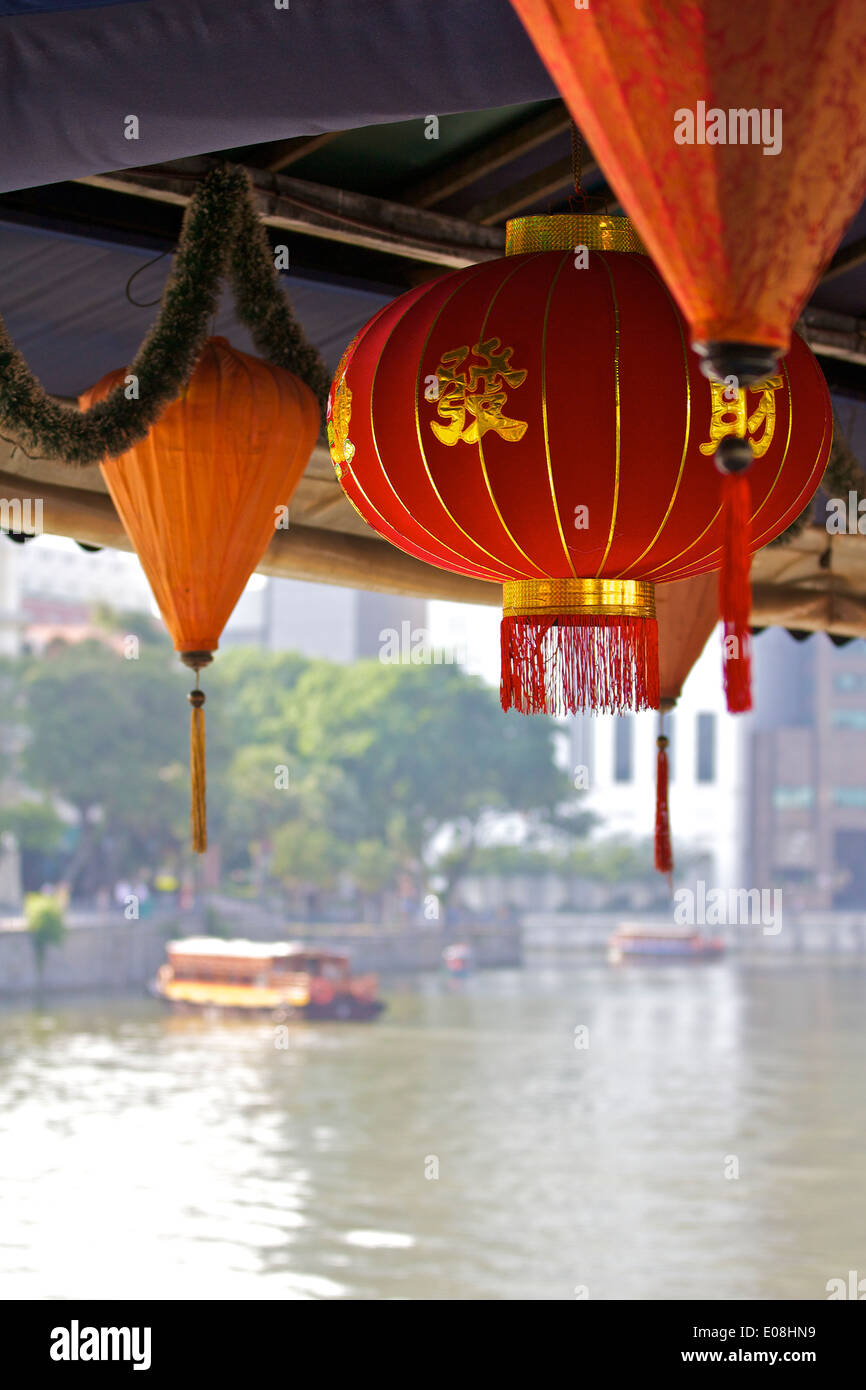 Traditional Chinese Paper Lanterns Hanging Over A Waterfront Restaurant