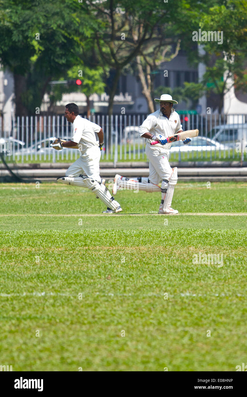 City Cricket, A Cricket Match On The Padang, Singapore. Stock Photo