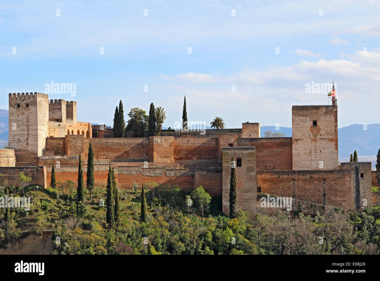 The Alcazaba fortifications of the Alhambra against the blue skies of Granada, Spain Stock Photo