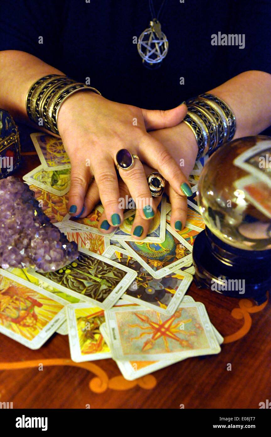 Berlin, Germany. 18th Feb, 2013. The hands of a fortune teller lie on tarot cards in Berlin, Germany, 18 February 2013. Fotoarchiv für Zeitgeschichte - NO WIRE SERVICE/dpa/Alamy Live News Stock Photo