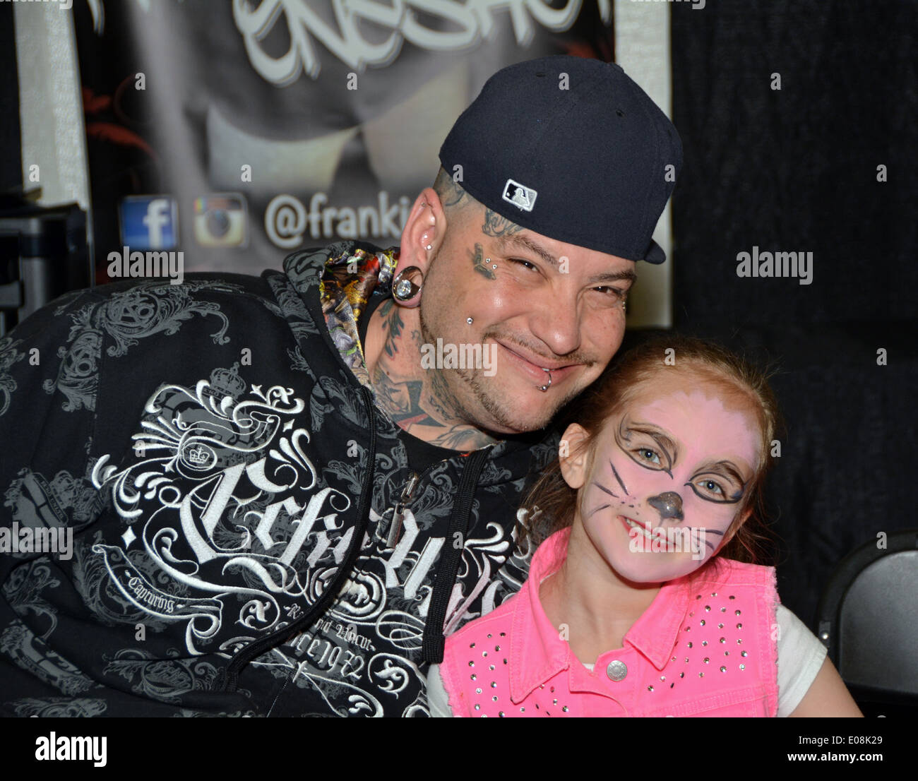 Portrait of of a tattoo artist & his daughter at the New York Tattoo Festival in Uniondale, Long Island, New York Stock Photo
