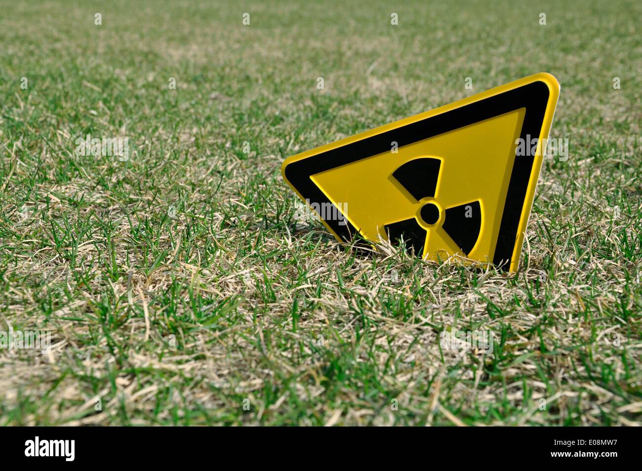 Berlin, Germany. 01st Apr, 2011. Illustration - A radioactive trefoil sign is stuck in a meadow in Berlin, Germany, 01 April 2011. Fotoarchiv für Zeitgeschichte - NO WIRE SERVICE/dpa/Alamy Live News Stock Photo