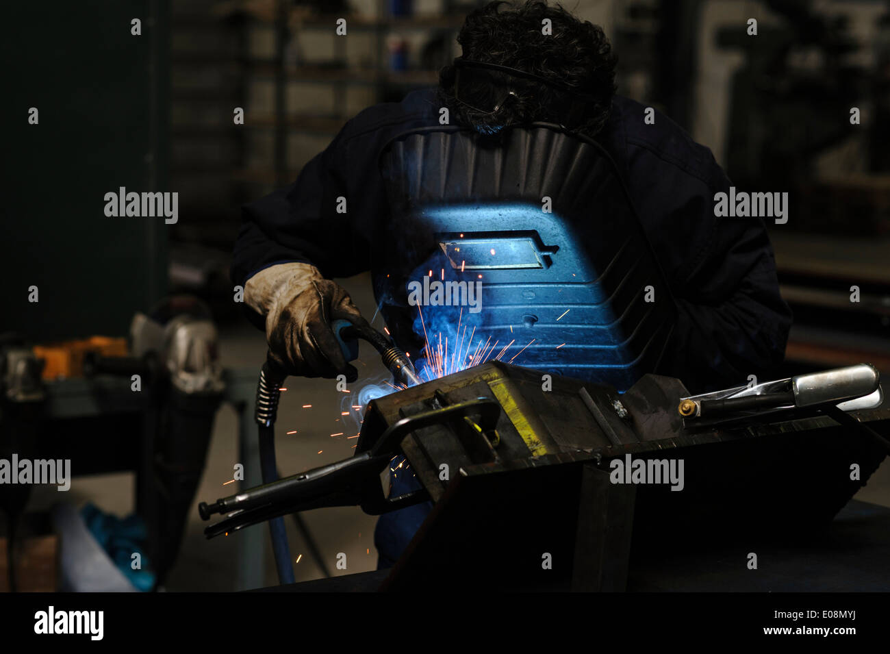Man welding with safety mask Stock Photo