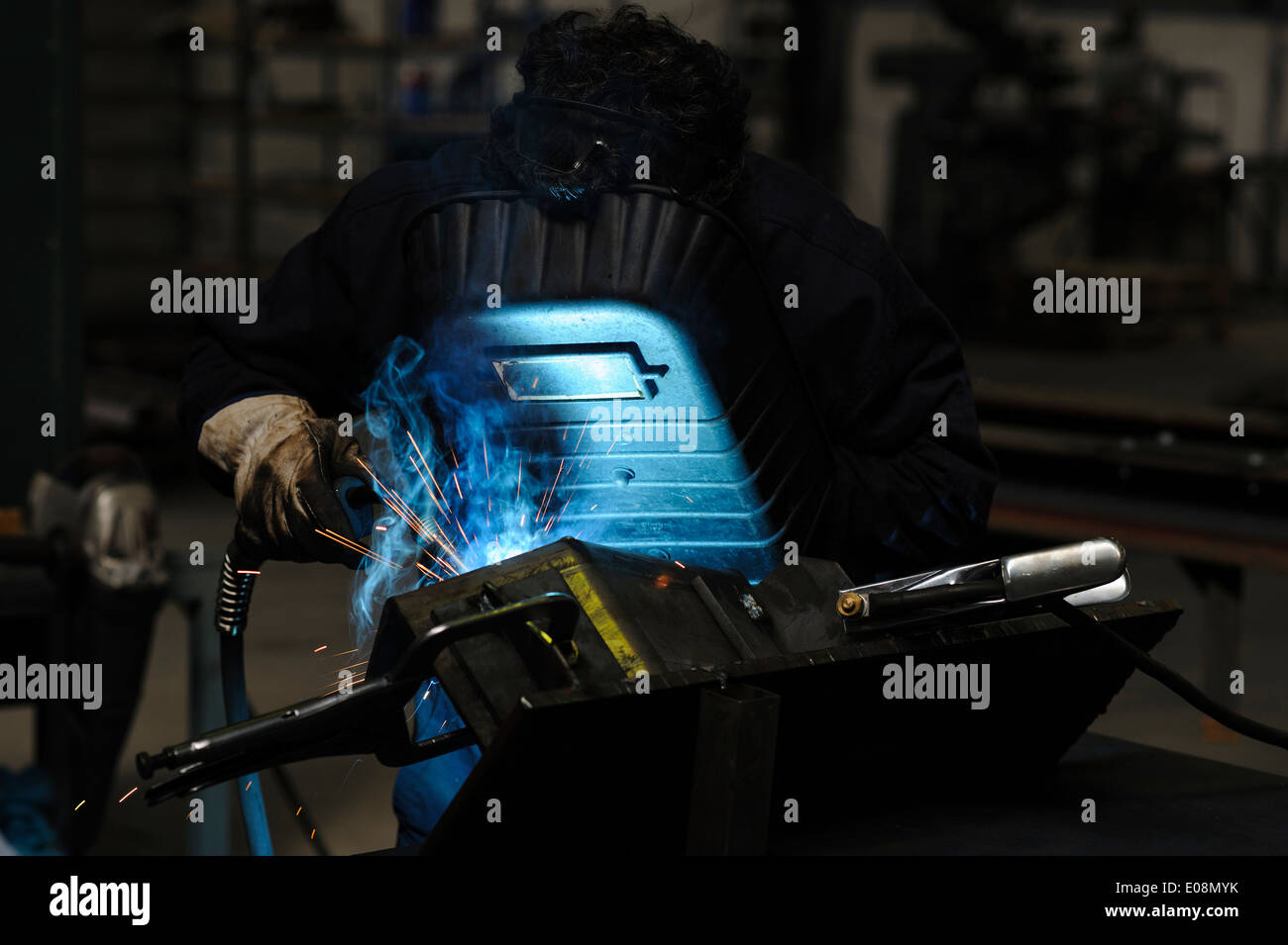 Man welding with safety mask Stock Photo