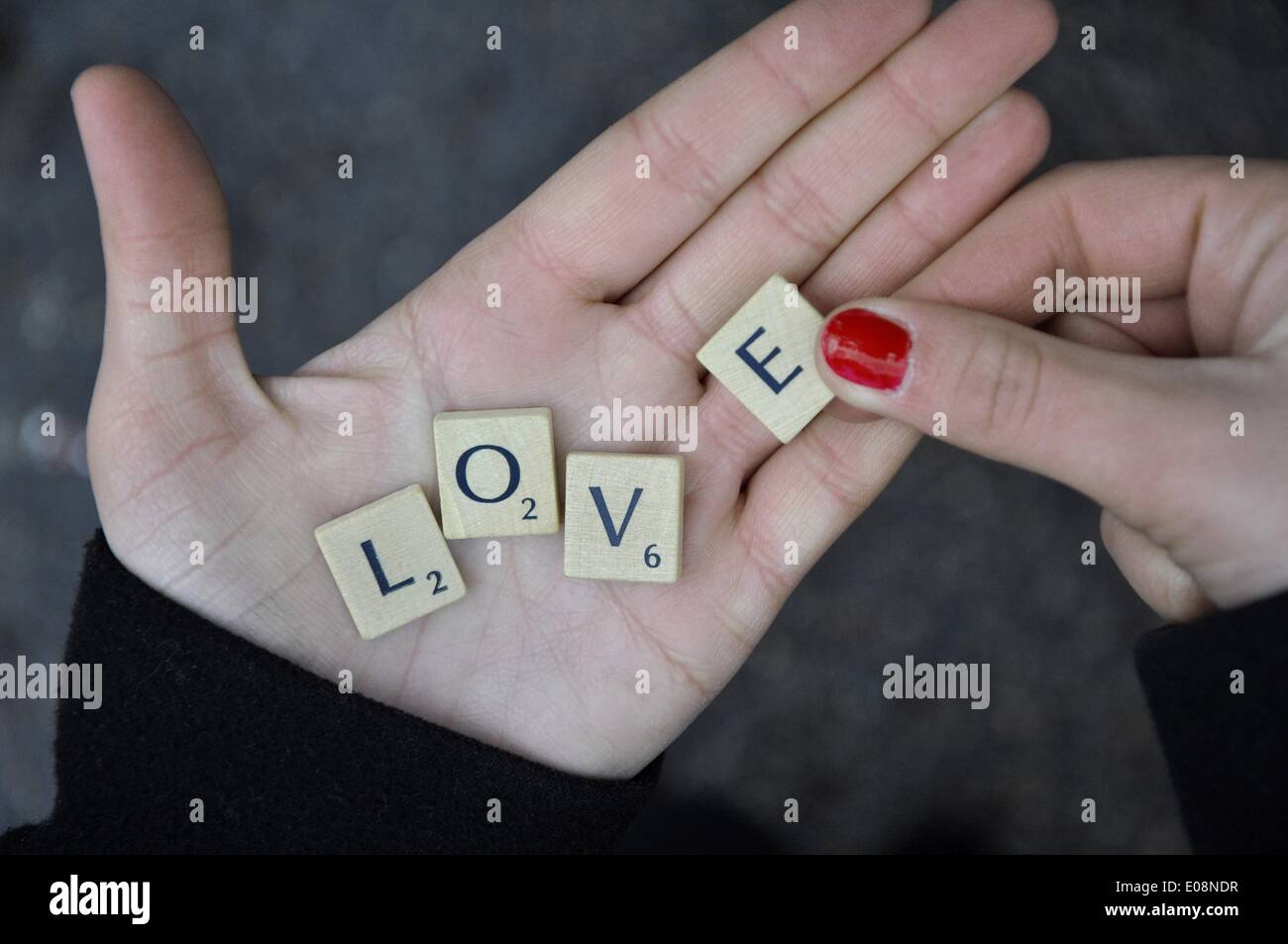 Illustration - Scrabble tiles on a women's hand form the word 'Love' in Germany, 17 January 2013. Fotoarchiv für Zeitgeschichte - NO WIRE SERVICE Stock Photo