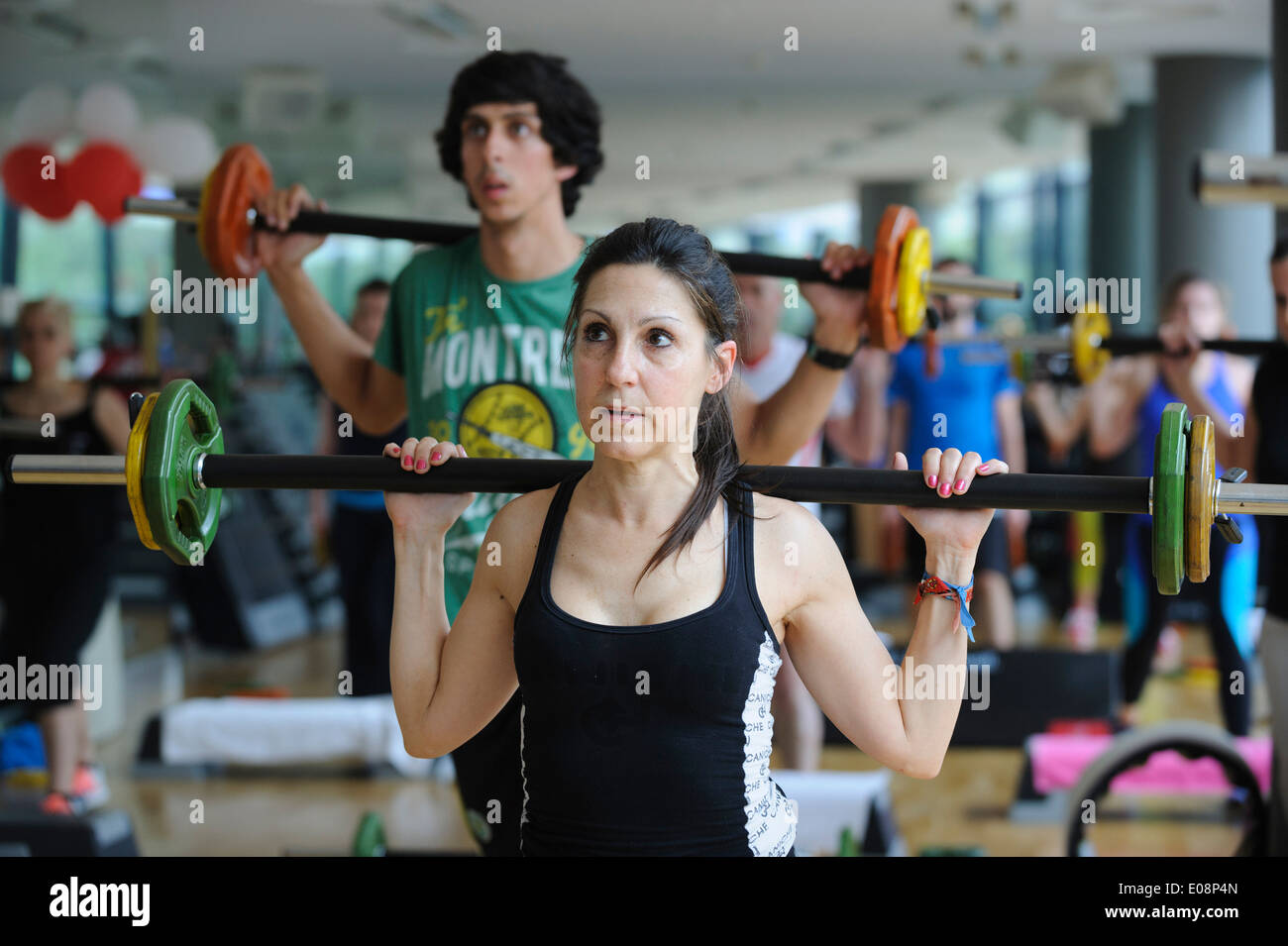 Woman during a Body Pump fitness class at the gym Stock Photo Alamy
