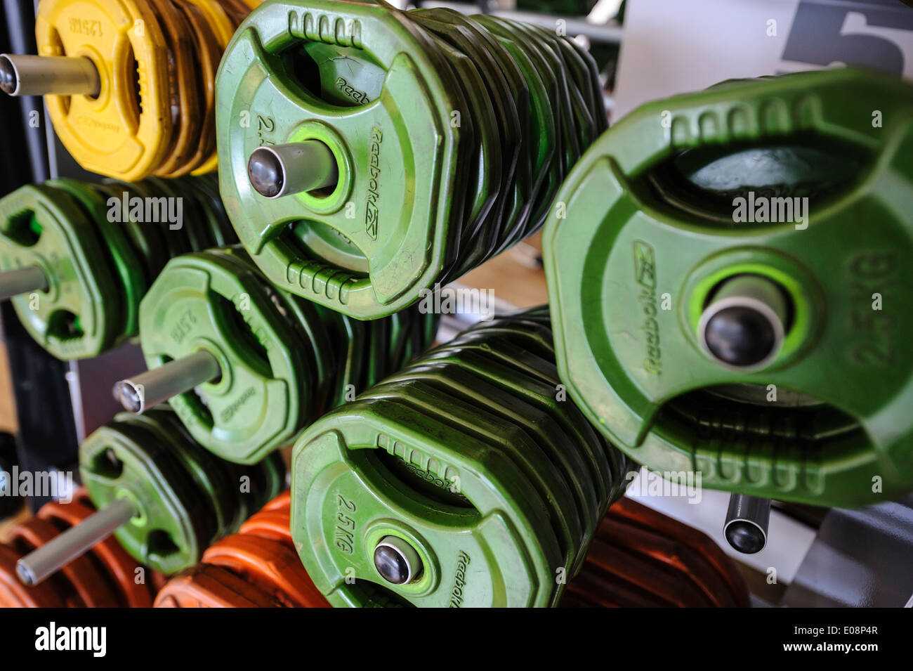 Colorful Reebok rubber coated weight plates at gym Stock Photo - Alamy