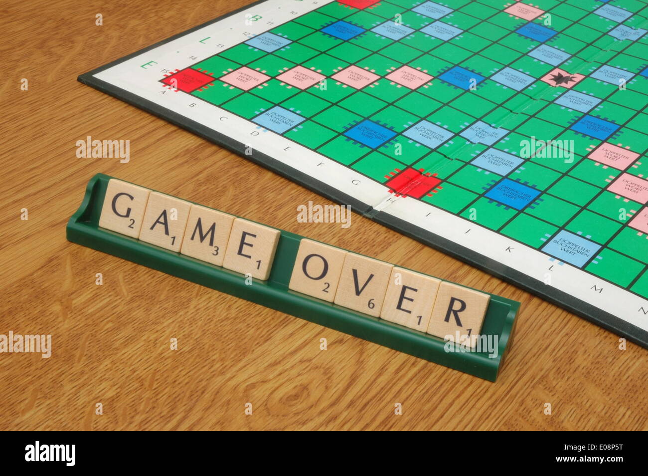Illustration Tiles form the phrase 'Game over' in front of a scrabble gameboard in Germany, 10