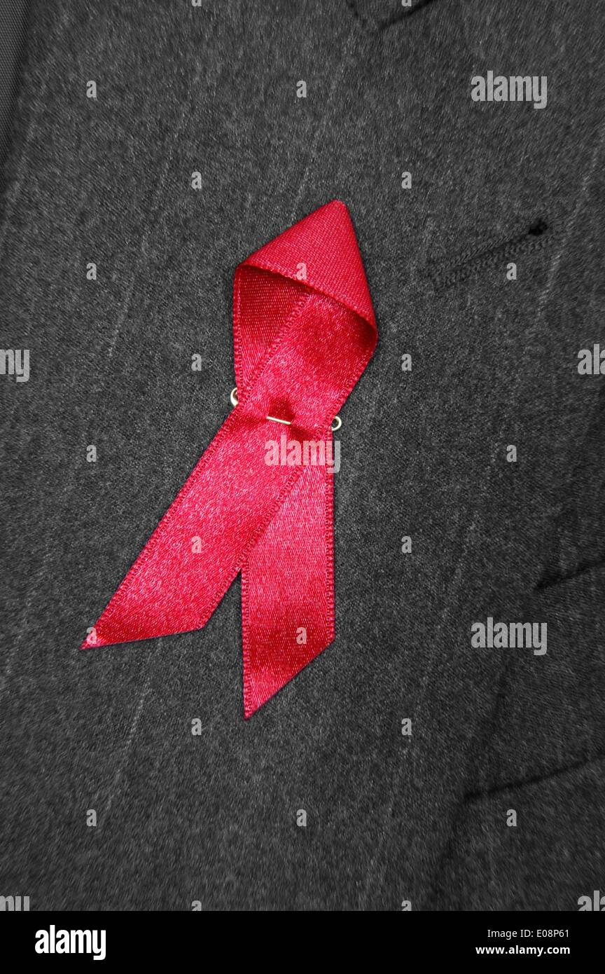 Illustration - A red ribbon is attached to a dark jacket in Germany, 06 January 2006. Fotoarchiv für ZeitgeschichteS. Steinach - NO WIRE SERVICE Stock Photo