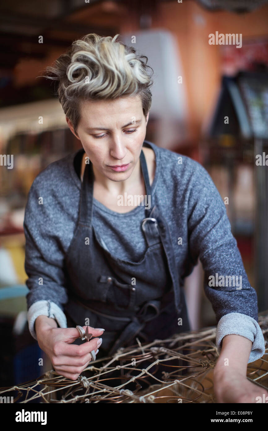 Female worker making chaise longue at Stock Photo Alamy