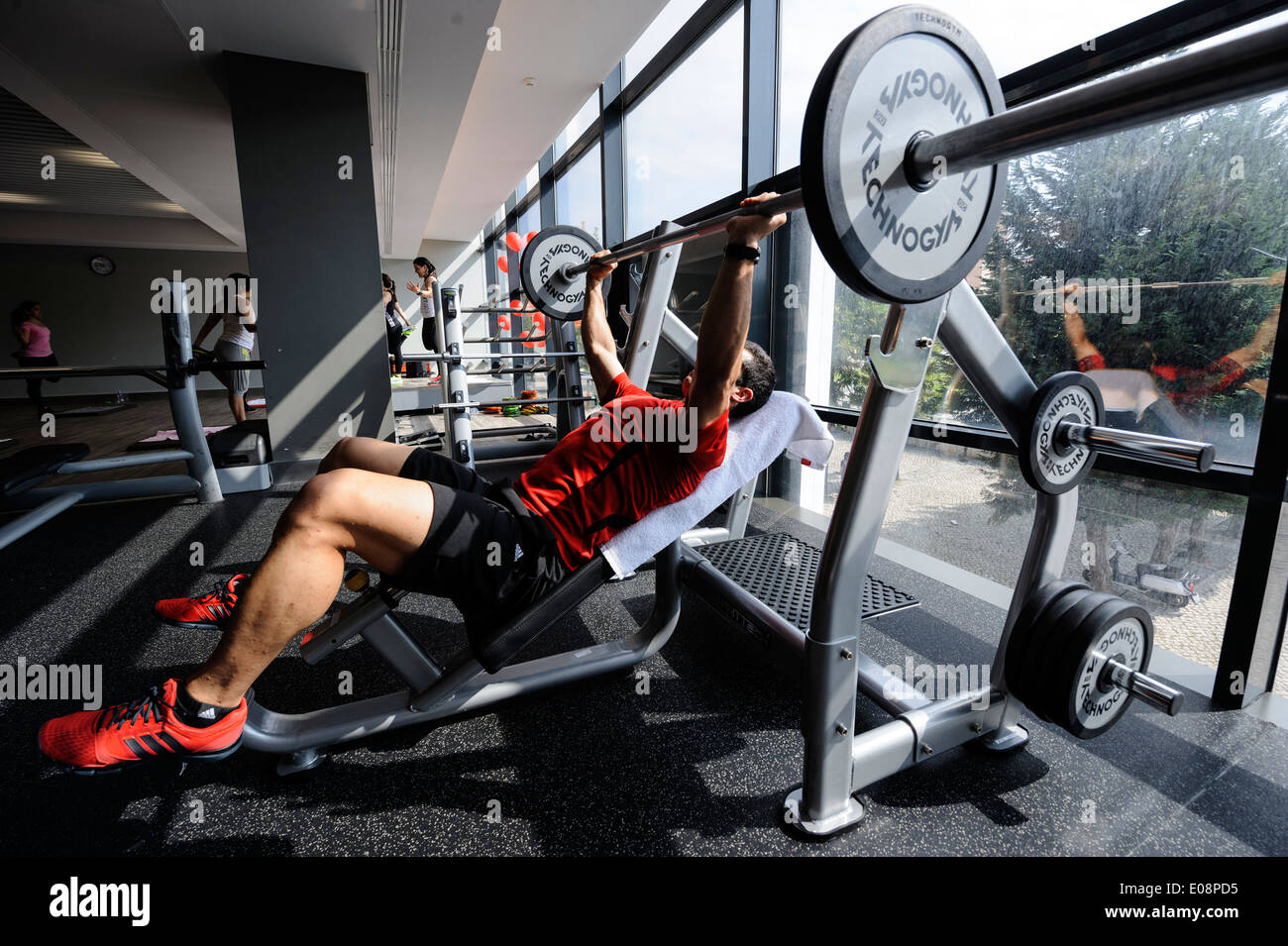Man lifting weights at the gym Stock Photo