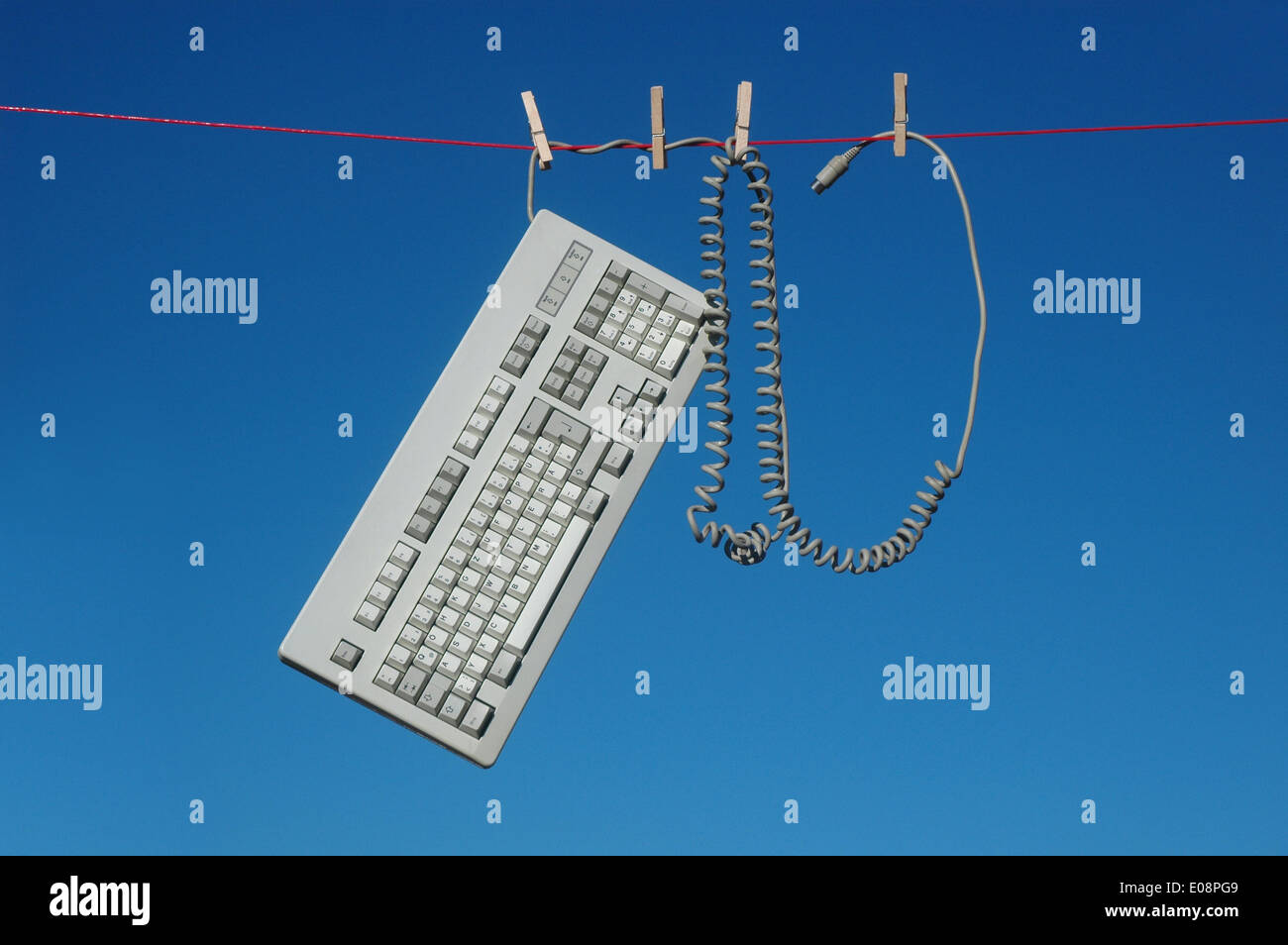 Illustration - A computer keyboard hangs from a clothes line in Germany, 14 June 2013. Fotoarchiv für Zeitgeschichte - ATTENTION! NO WIRE SERVICE – Stock Photo