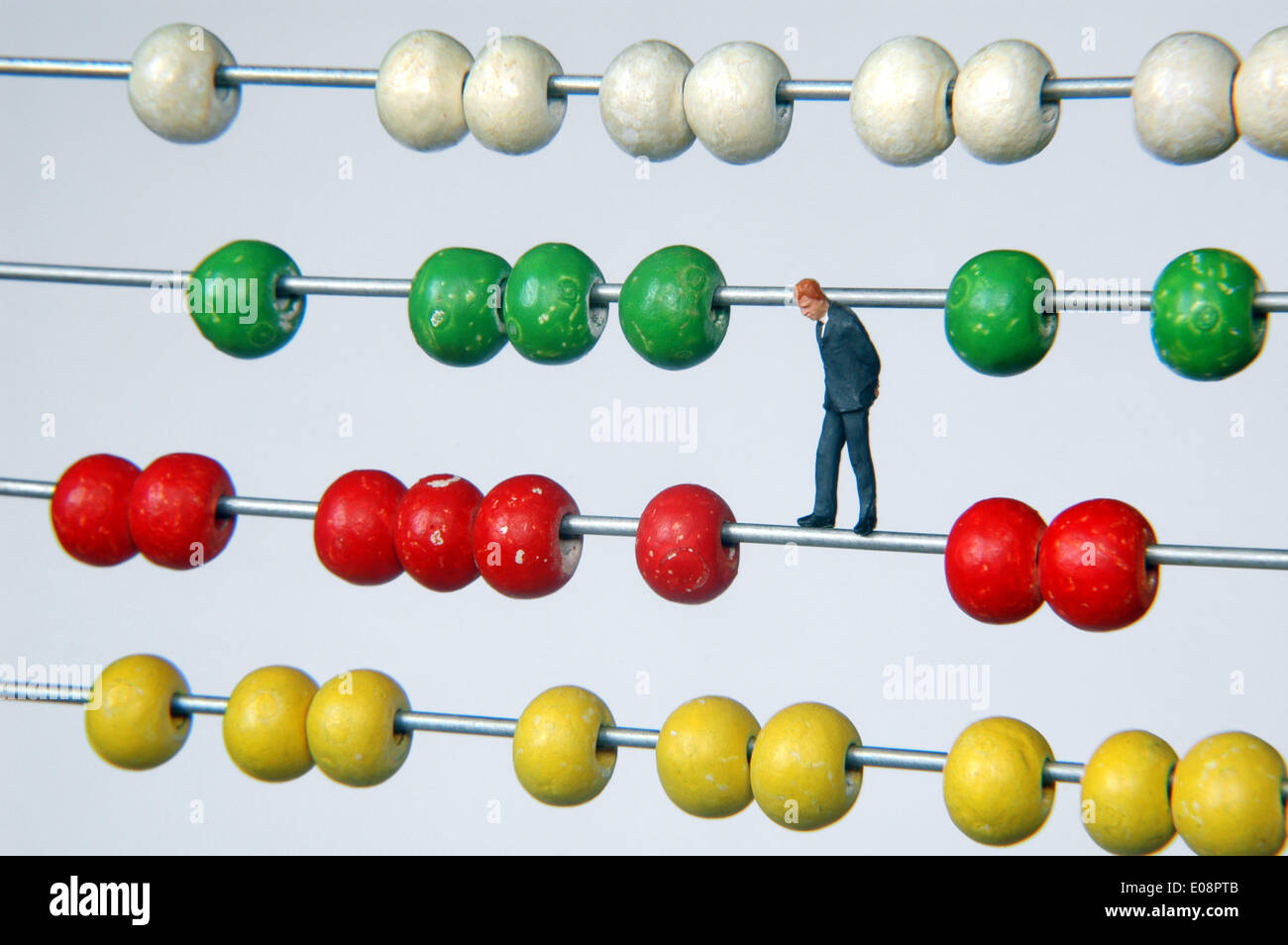 Illustration - A manager figure stands on an abacus in Germany, 24 June 2009. Photo: Berliner Verlag/Steinach - NO WIRE SERVICE Stock Photo