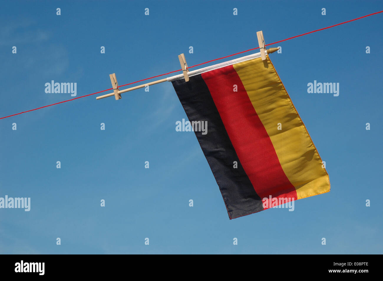 Illustration - A German flag hangs from a clothes line in Germany, 06 June 2009. Fotoarchiv für Zeitgeschichte - ATTENTION! NO WIRE SERVICE – Stock Photo