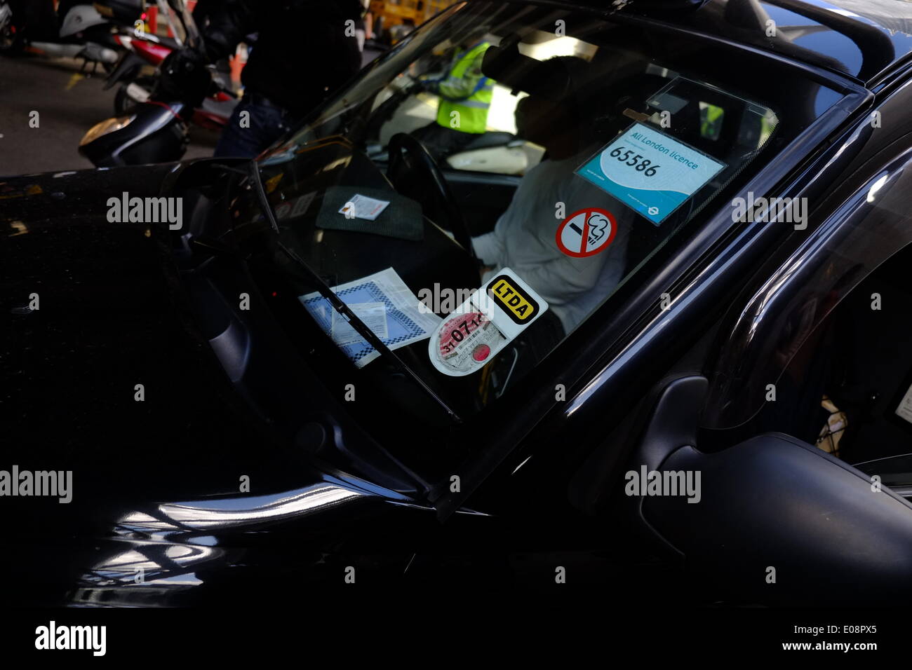 London, UK. 06th May, 2014. Black Cabbies held a demo near the Shard against TFL causing traffic chaos.  Police ticket visible in Cab Credit:  Rachel Megawhat/Alamy Live News Stock Photo