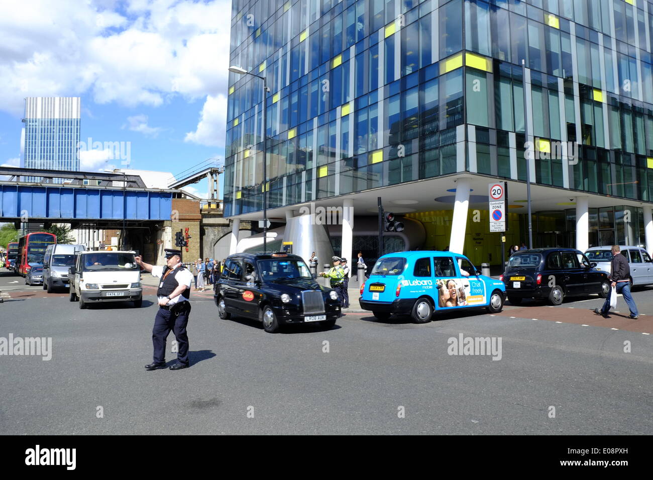 London, UK. 06th May, 2014. Black Cabbies held a demo near the Shard against TFL causing traffic chaos.  Cabs block the road outside TFL headquarters. Credit:  Rachel Megawhat/Alamy Live News Stock Photo
