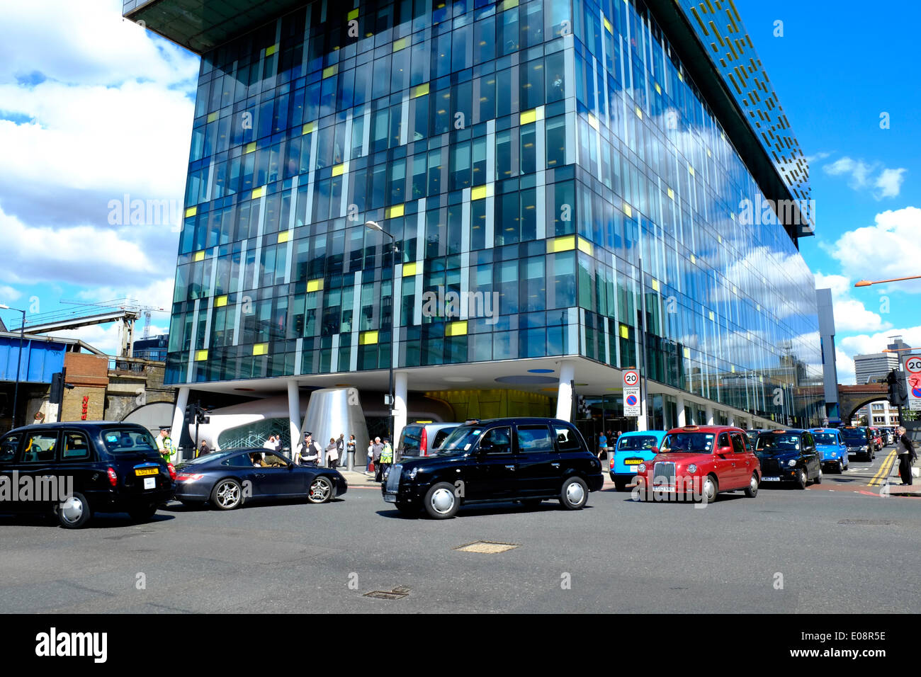 London, UK. 06th May, 2014. Black Cabbies held a demo near the Shard against TFL causing traffic chaos.  Cabs block the road outside TFL headquarters. Credit:  Rachel Megawhat/Alamy Live News Stock Photo