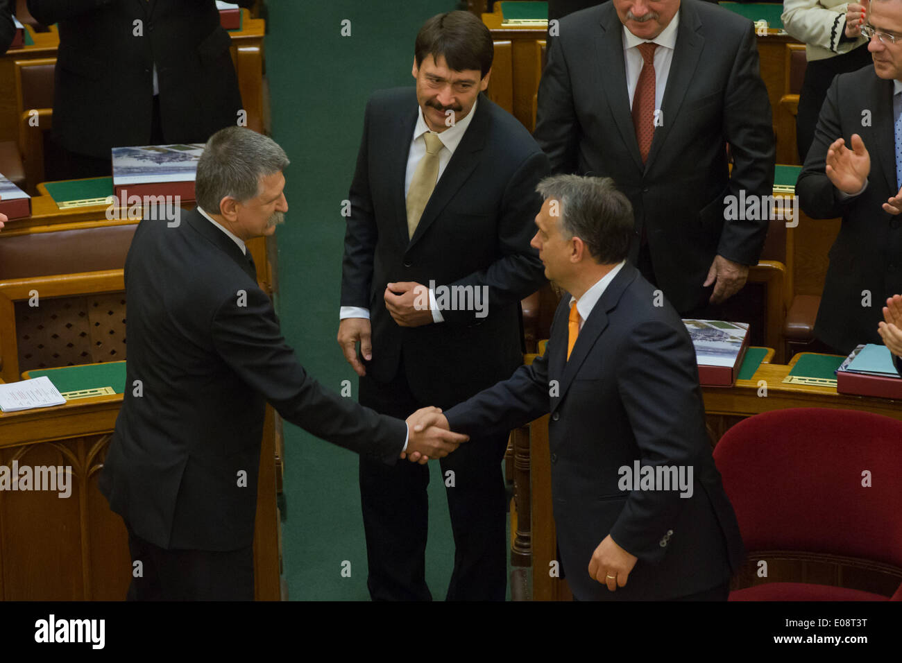Budapest, Hungary. 6th May, 2014. Hungarian President Janos Ader (C) and Prime Minister Viktor Orban (R) congratulate Laszlo Kover (L), the reelected speaker of new Hungarian Parliament during the foundation session of the new Parliament, in Budapest, Hungary, on May 6, 2014. © Attila Volgyi/Xinhua/Alamy Live News Stock Photo