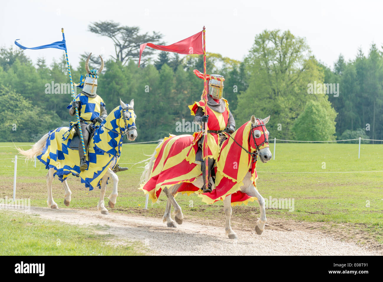 Two knights canter to the arena at Blenheim Palace Jousting Tournament ...