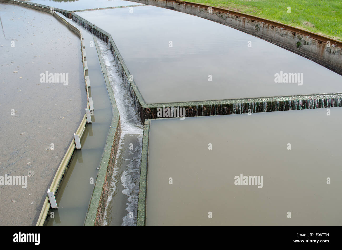 Closeup of water flow filtration sedimentation stage in water treatment facility plant equipment. Stock Photo