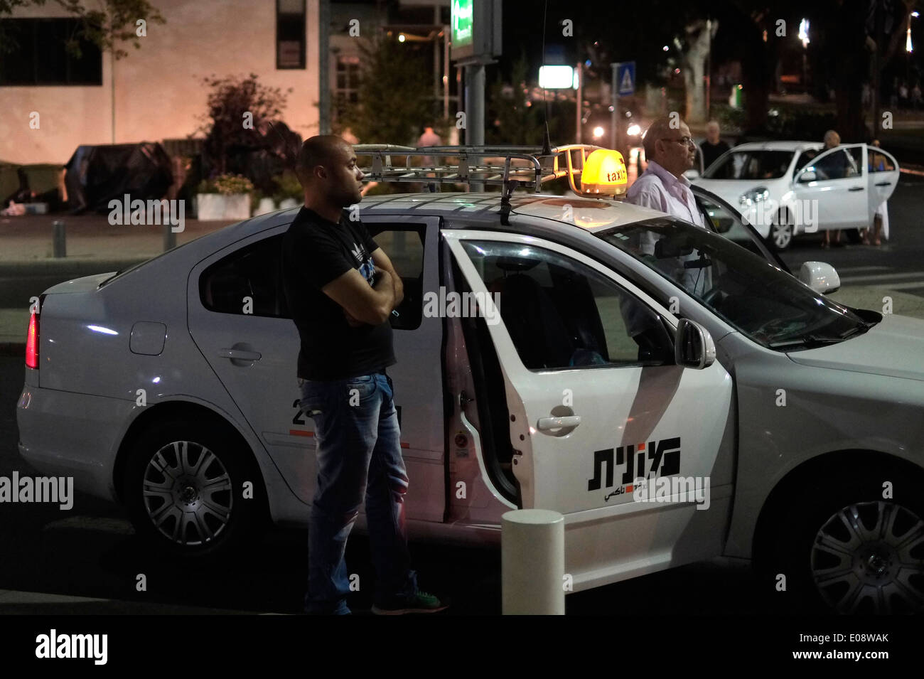 Israeli civilians standing still as a siren sounds to commemorate fallen soldiers on Israel's Memorial Day in Tel Aviv Israel Stock Photo