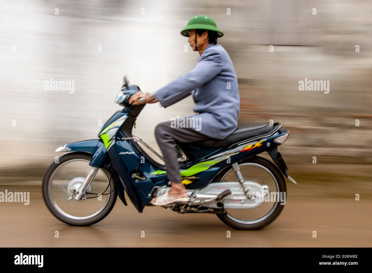 Vietnamese Motorcycle Rider Vietnamese people riding a motorcycle hi-res stock photography and ...