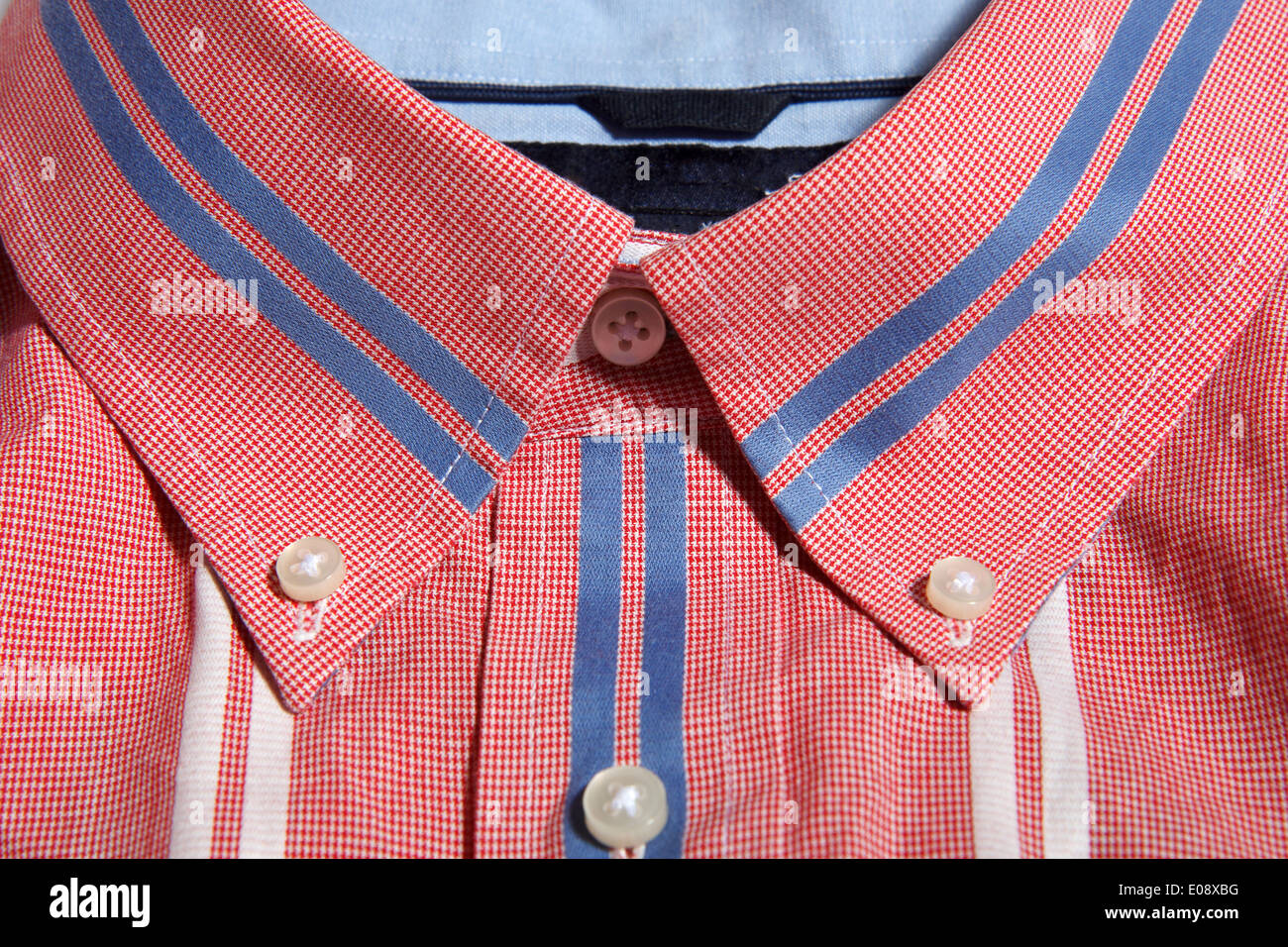 Red button down shirt hires stock photography and images Alamy