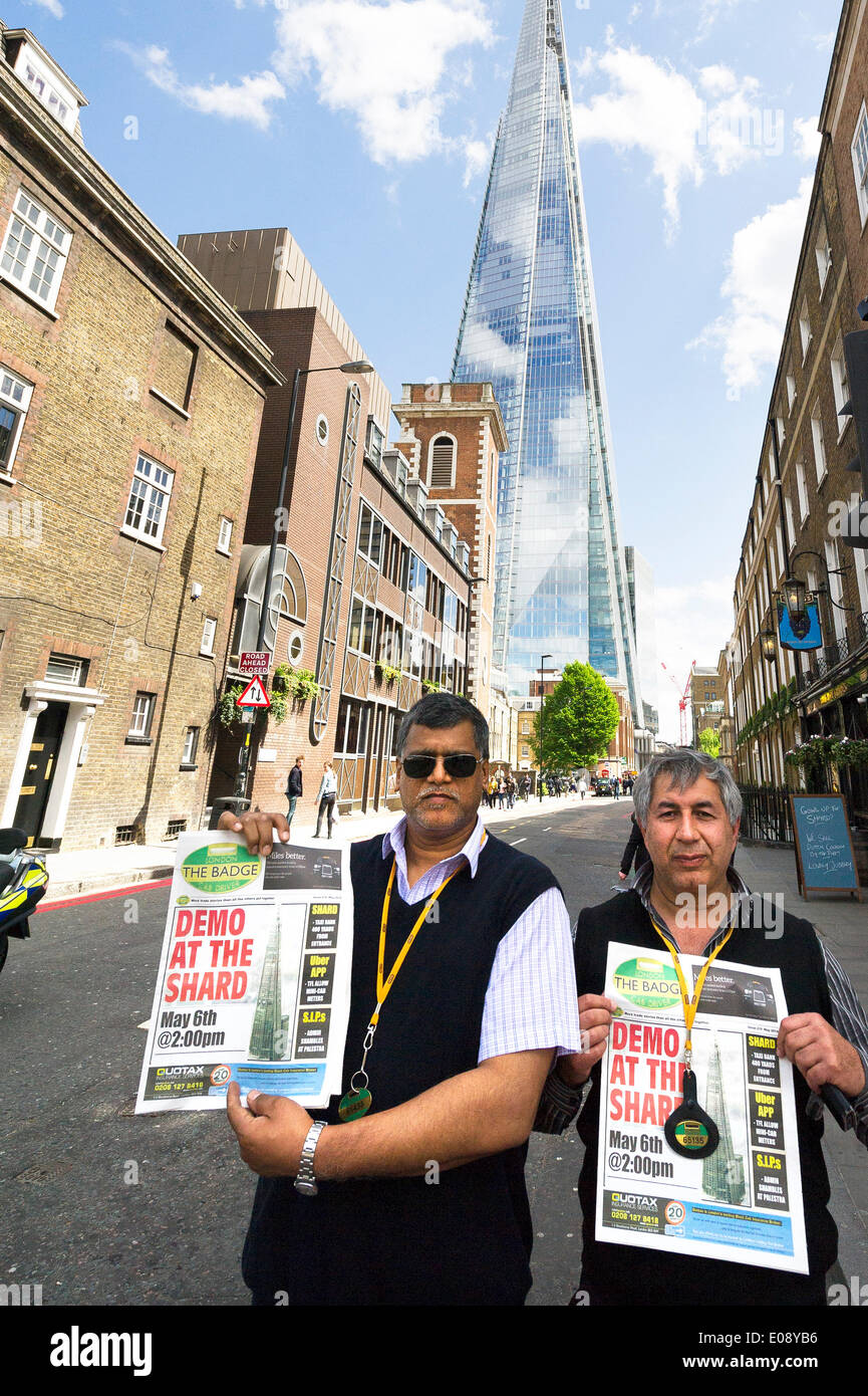 London, UK. 6th May 2014, London. Two London Black Cab drivers protest in response to TFL's decision not to allow a Black Cab taxi rank outside the entrance to The Shard.  Photographer:  Gordon Scammell/Alamy Live News Stock Photo
