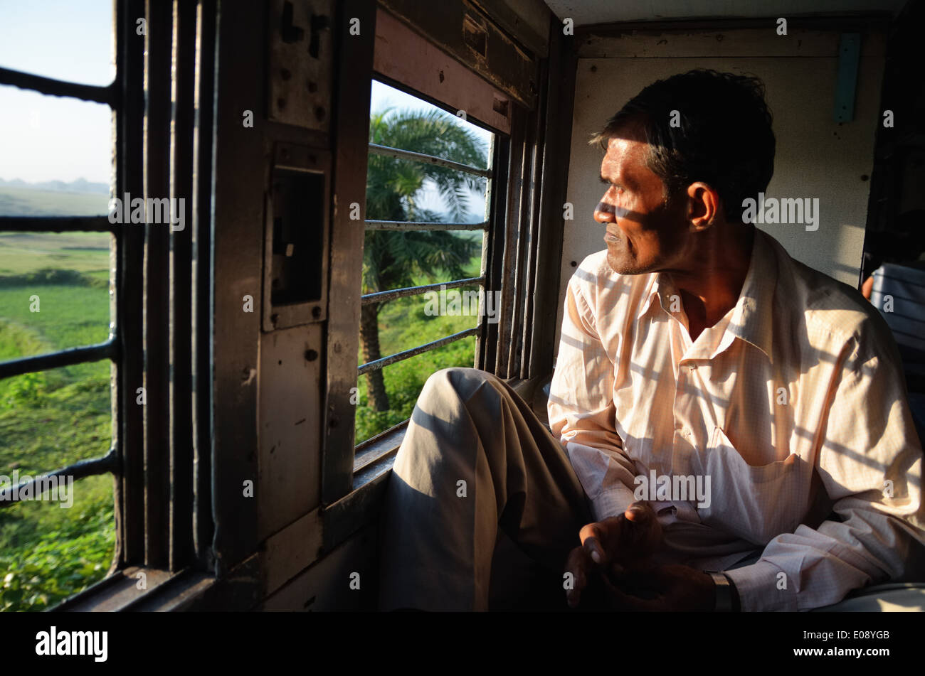 Indian man in train to Kolkata, India Stock Photo