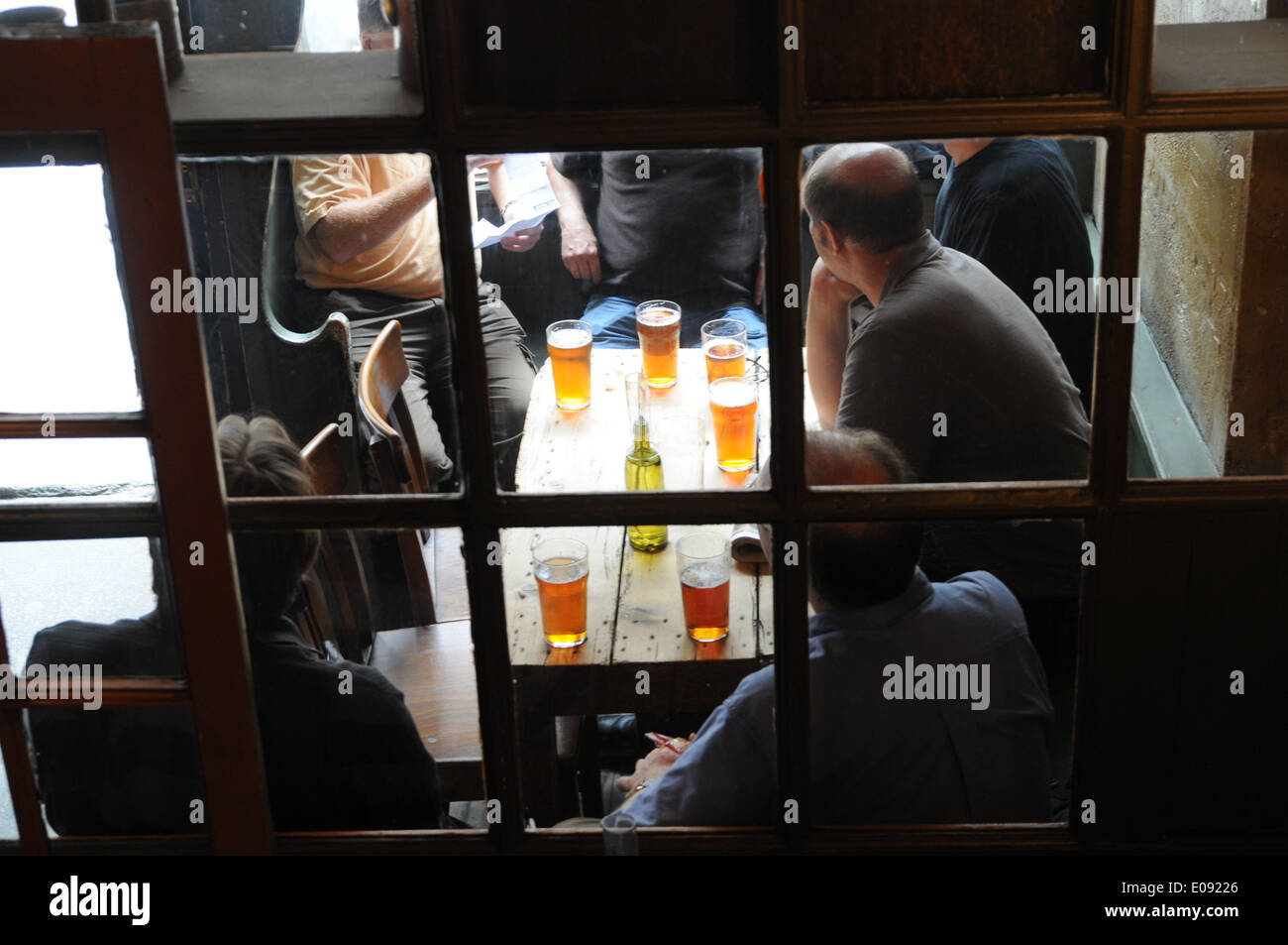 Men drinking beer in The Jerusalem Tavern, Clerkenwell, London, England Stock Photo