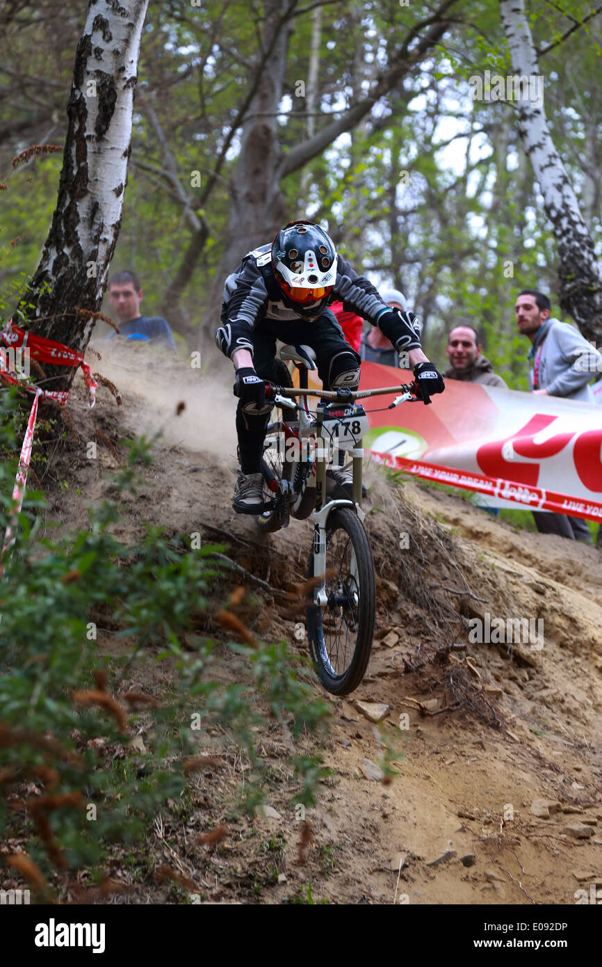Rider going down in the dust. Down Hill mountain biking race in Chaudfontaine in Belgium