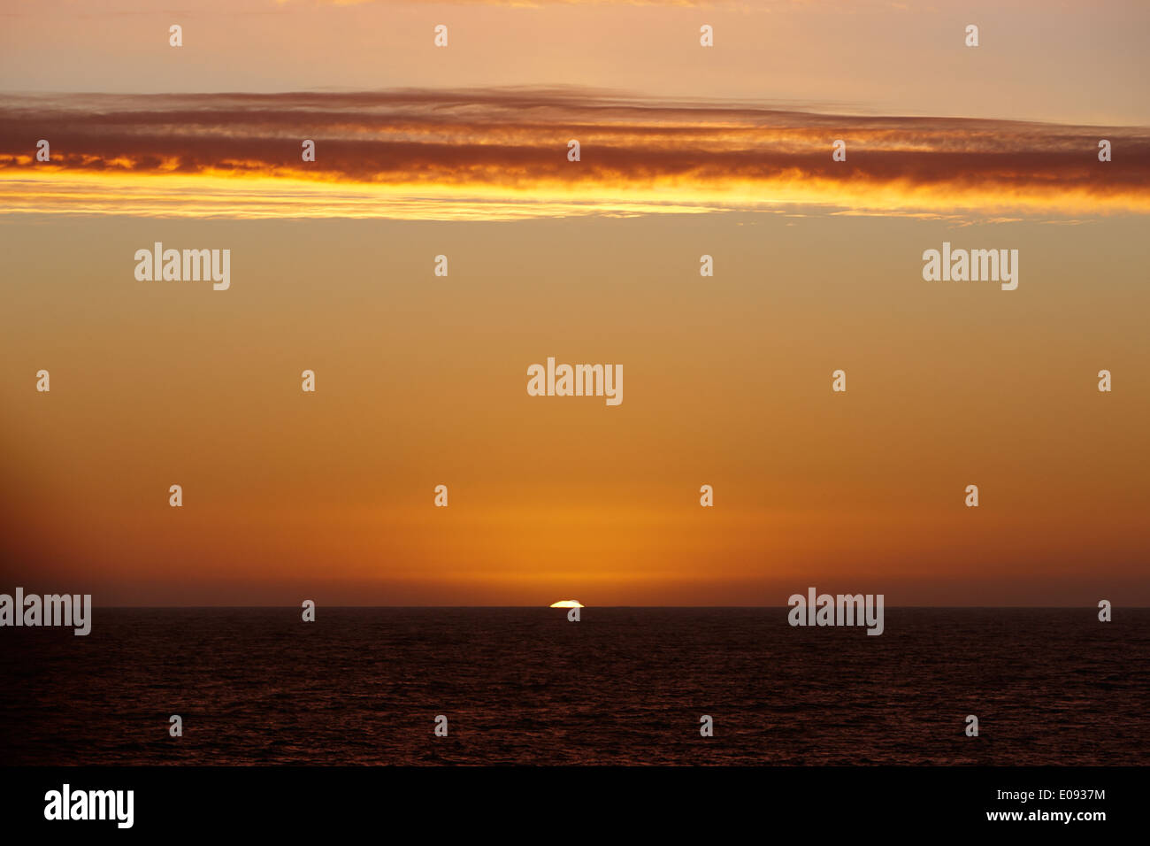 sun setting over the antarctic ocean Antarctica Stock Photo