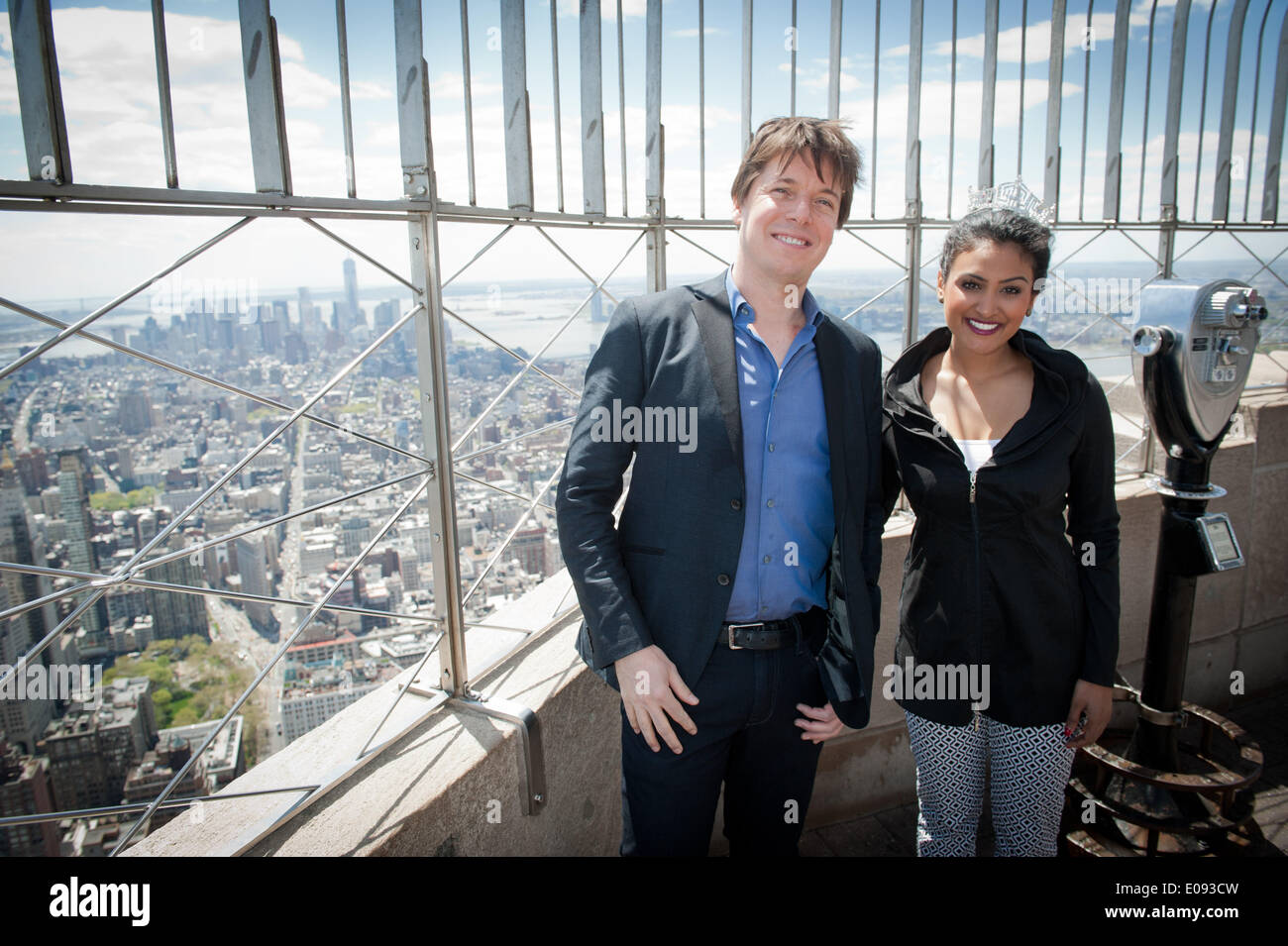 Manhattan, New York, USA. 6th May, 2014. Grammy-award wining violinist JOSHUA BELL and Miss America 2014 NINA DAVULURI light the Empire State Building in purple in honor of Education Through Music, Tuesday, May, 6, 2014. Credit:  Bryan Smith/ZUMAPRESS.com/Alamy Live News Stock Photo