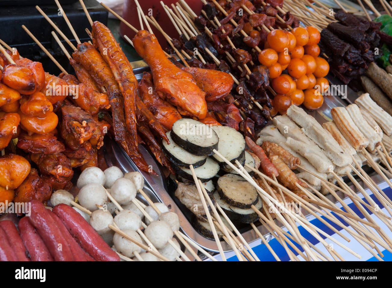 South East Asia Myanmar Burma Yangon Rangoon traditional Burmese street food on bamboo skewers ready for barbecue Stock Photo