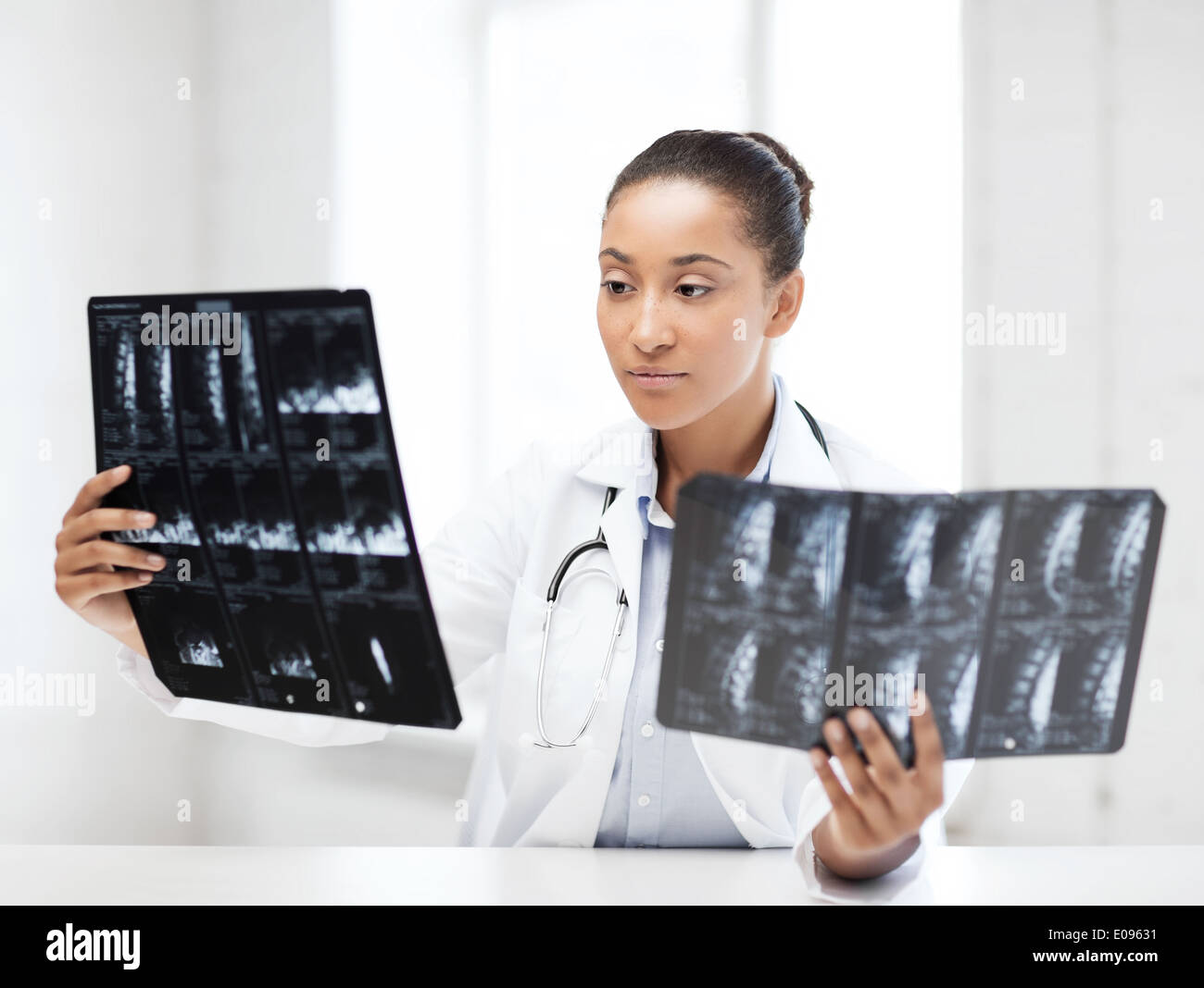 african doctor looking at x-rays Stock Photo - Alamy