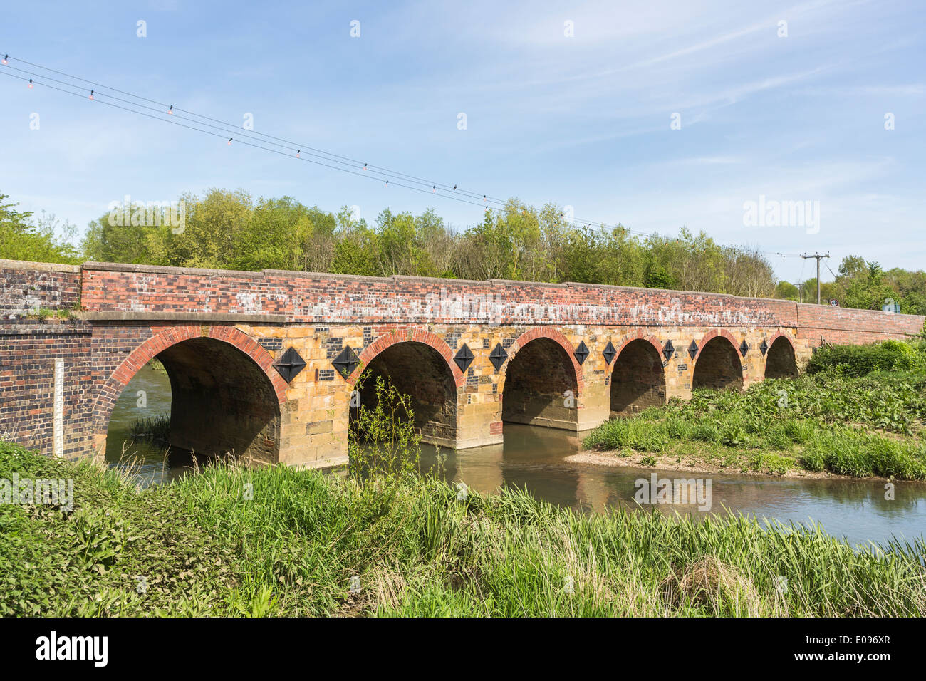 Brick and stone built road bridge over the River Stour in Shipstonon