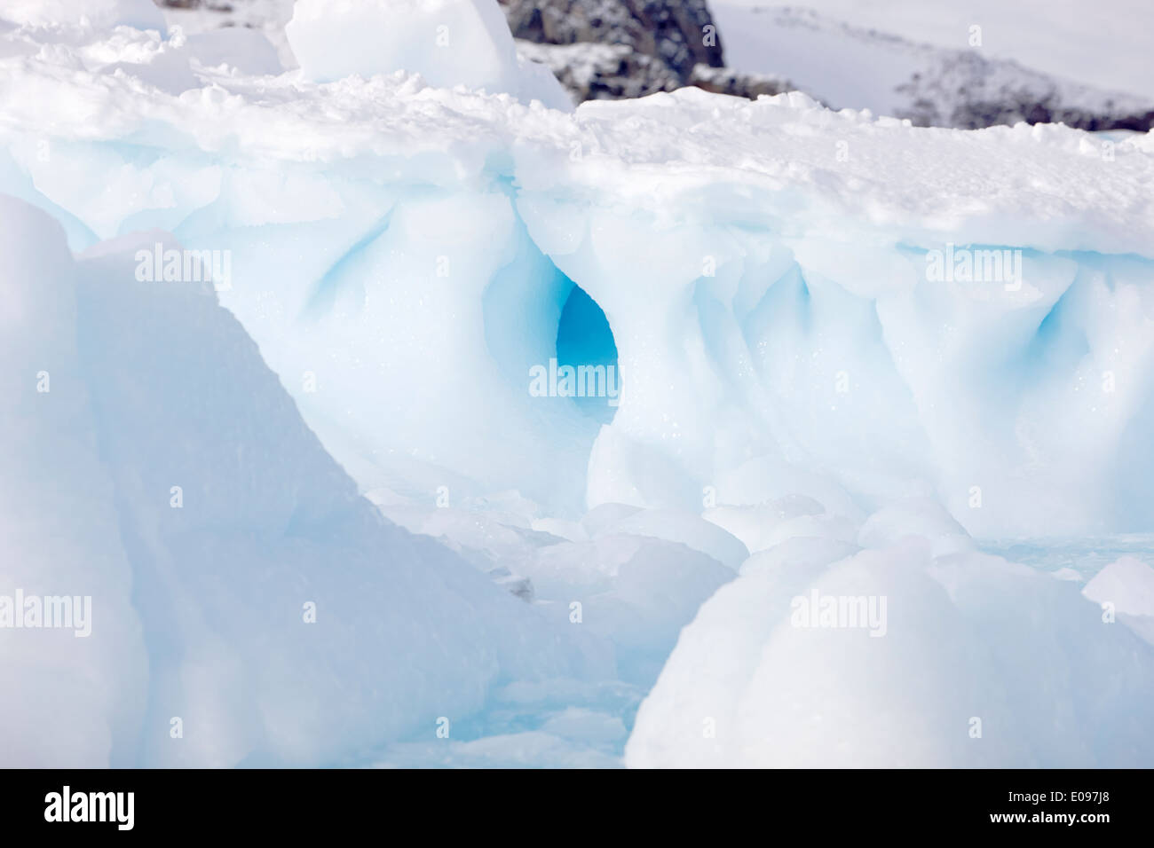 older blue ice formed from fresh water against white new ice and fresh