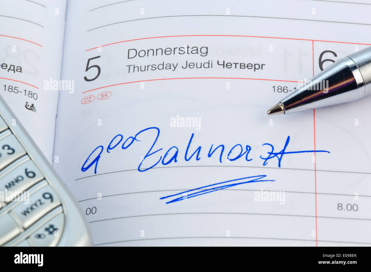 An appointment is put down in a calendar: Dentist, Ein Termin ist in einem Kalender eingetragen: Zahnarzt Stock Photo