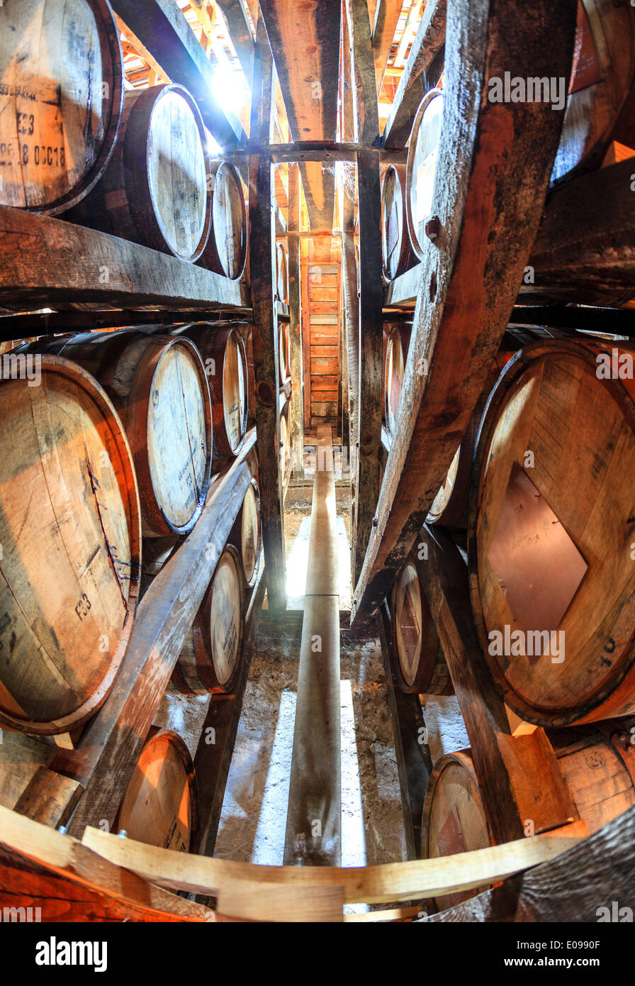 Bourbon barrels are aging in a warehouse Stock Photo